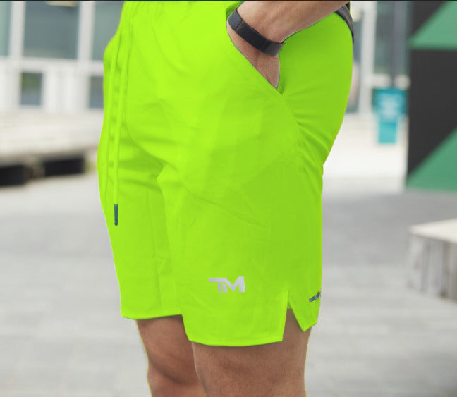 Neon green shorts.